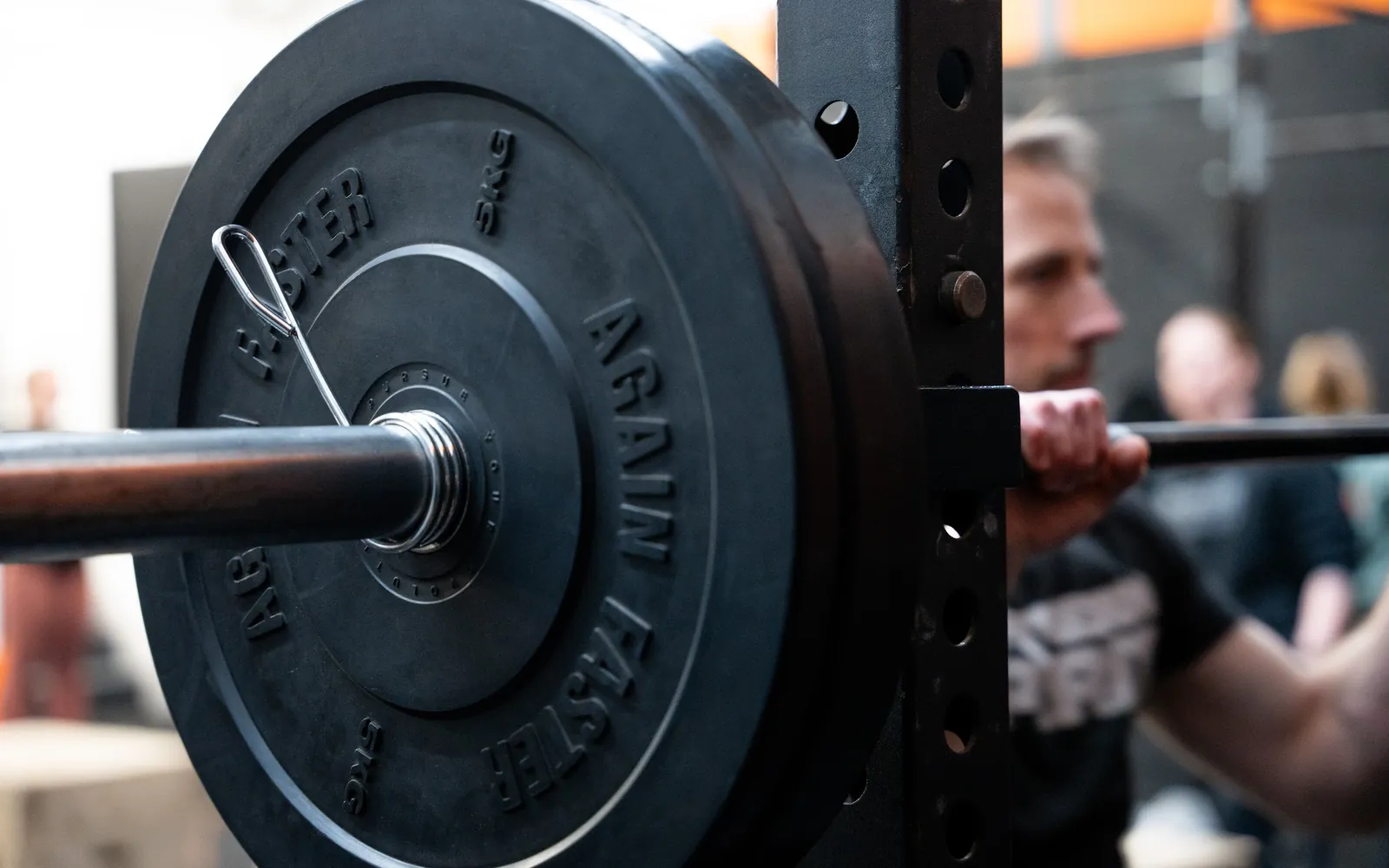 A loaded barbell resting in the rack